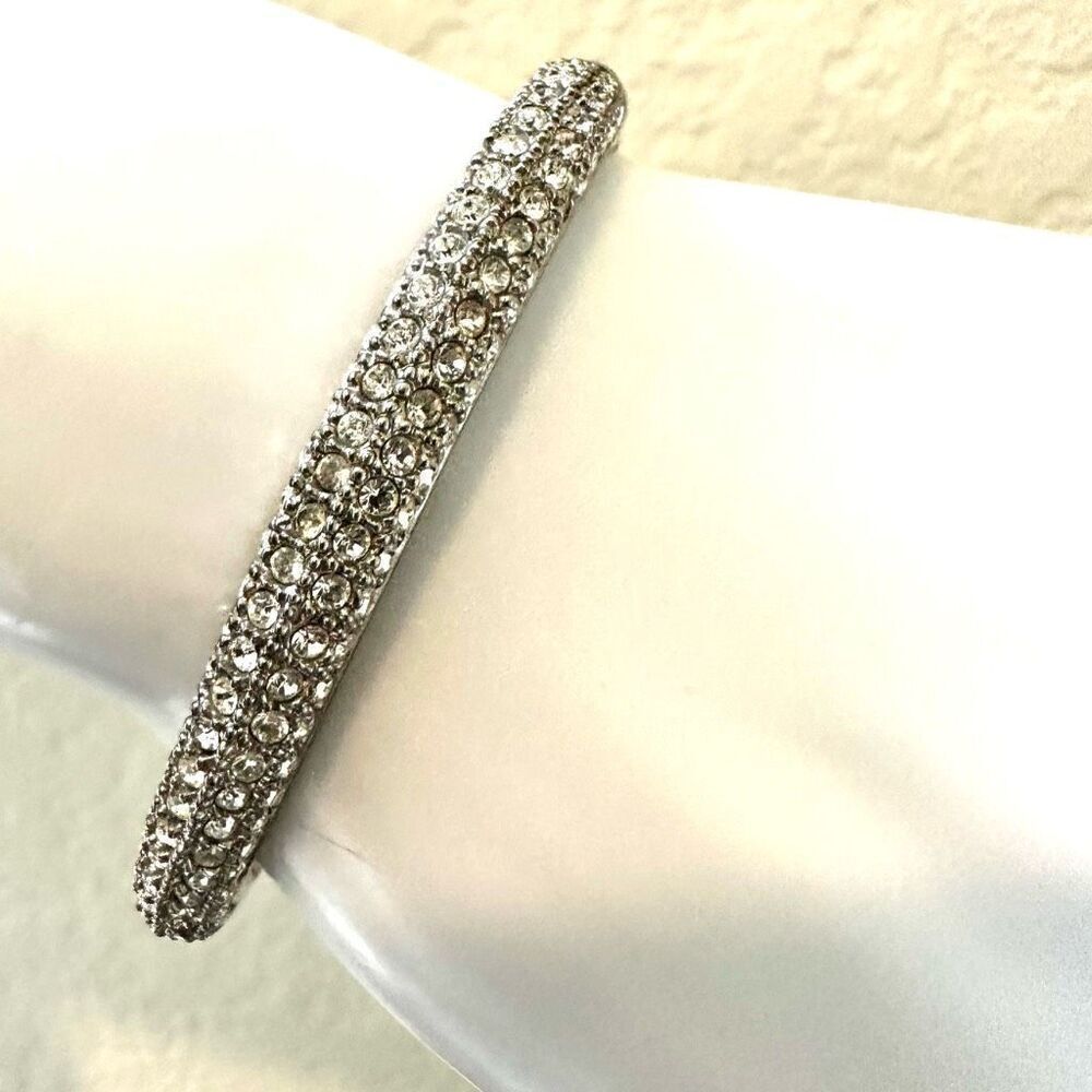 Silver tone hinged rhinestone bangle bracelet